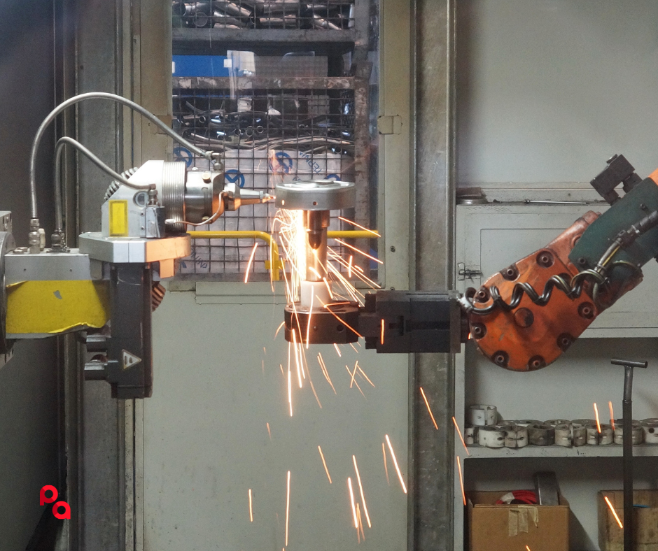 [Imagen de un brazo robótico industrial]